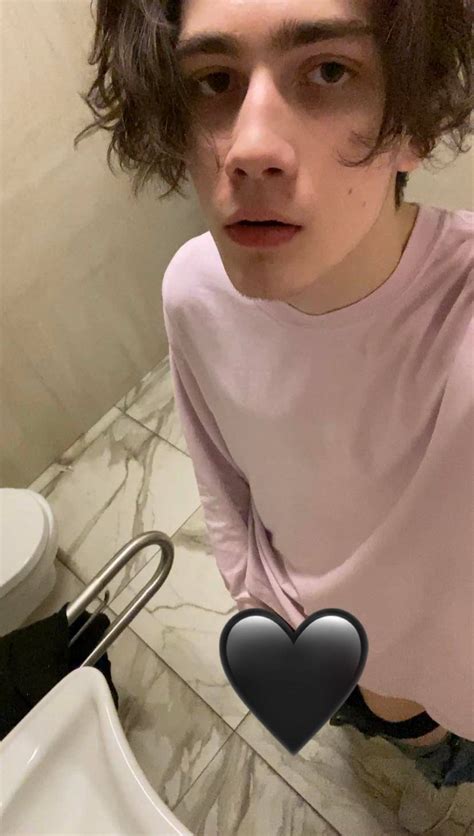 young boy jerking off in bed .